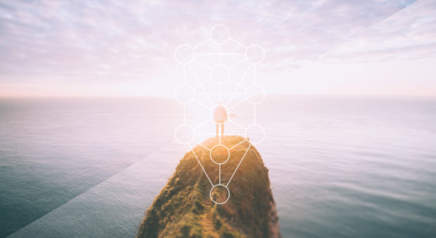 man standing on cliff over water with tree of live overlaid over him